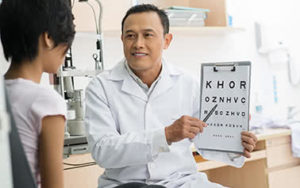 Eye Doctor with Child for Eye Exam